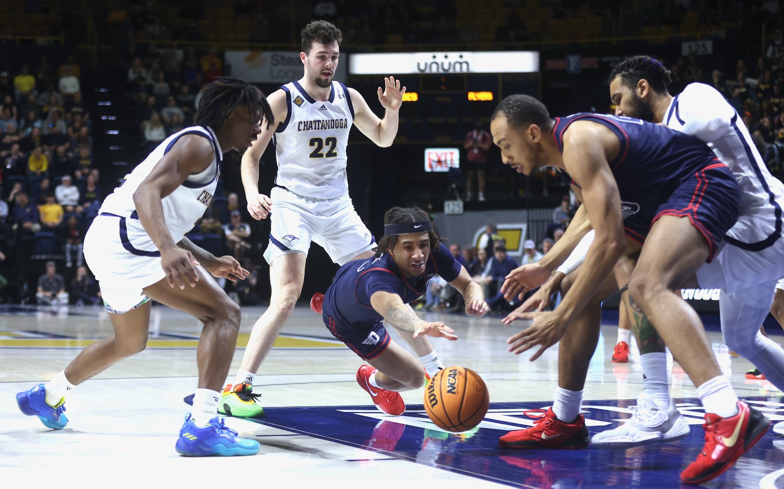 Dayton's Javon Bennett dives for a loose ball in the first half against Chattanooga in the second round of the National Invitation Tournament on Saturday, March 22, 2025, at McKenzie Arena in Chattanooga, Tenn. David Jablonski/Staff