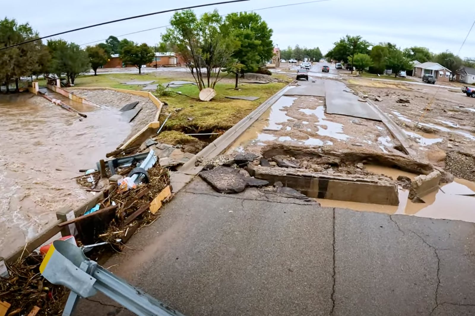 In this image taken from video, debris and damage and are seen from severe flooding in Roswell, N.M., Sunday, Oct. 20, 2024. (Juliana Halvorson via AP)