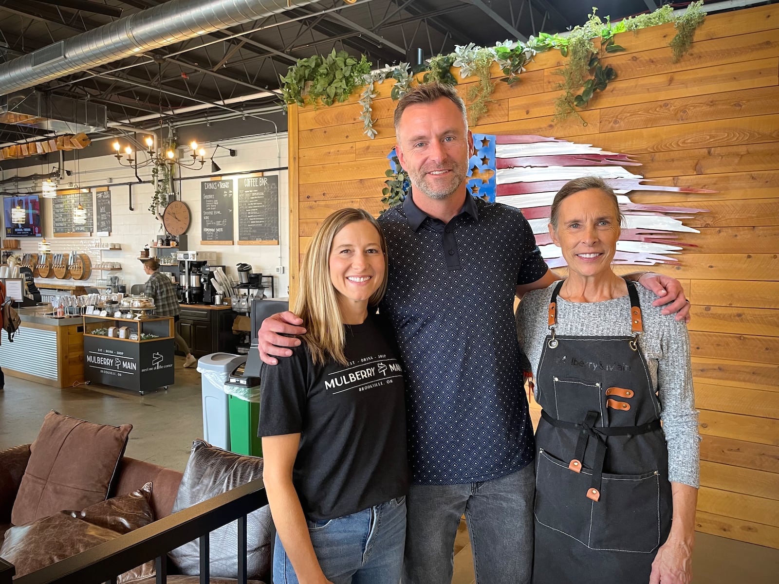 Mulberry & Main, a new bistro with a coffee bar, beer taps and two rooms filled with antiques, is located at 130 Main St. in Brookville. Pictured are owners Brandie and Jeff Wright with executive chef Amy Wright. NATALIE JONES/STAFF