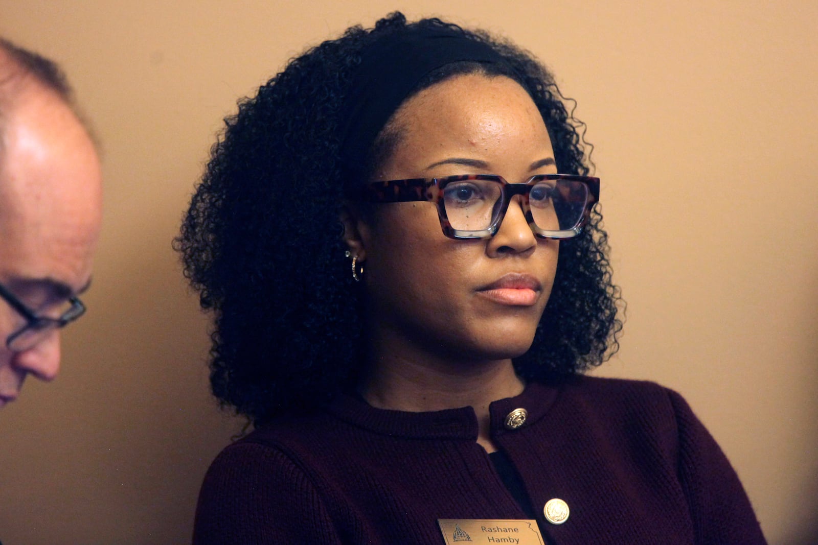 Rashane Hamby, policy director for the American Civil Liberties Union of Kansas, follows testimony in a legislative committee hearing on a proposal her group opposes to have state Supreme Court justices elected rather than appointed by the governor after applicants are screened by a nominating commission, Tuesday, Feb. 25, 2025, at the Statehouse in Topeka, Kans. (AP Photo/John Hanna)