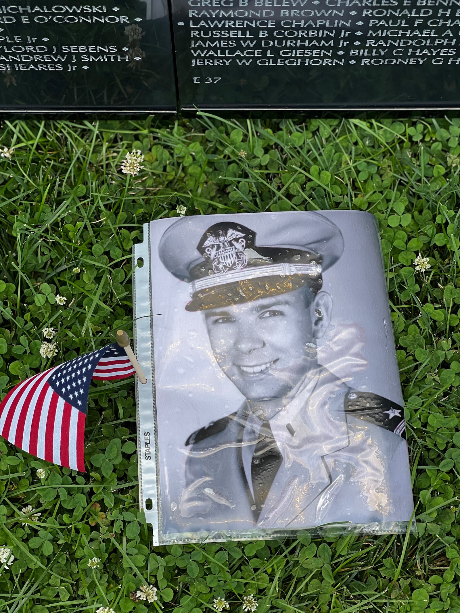 Some visitors to the traveling Vietnam memorial left photos of lost loved ones near their names on the wall. AIMEE HANCOCK/STAFF