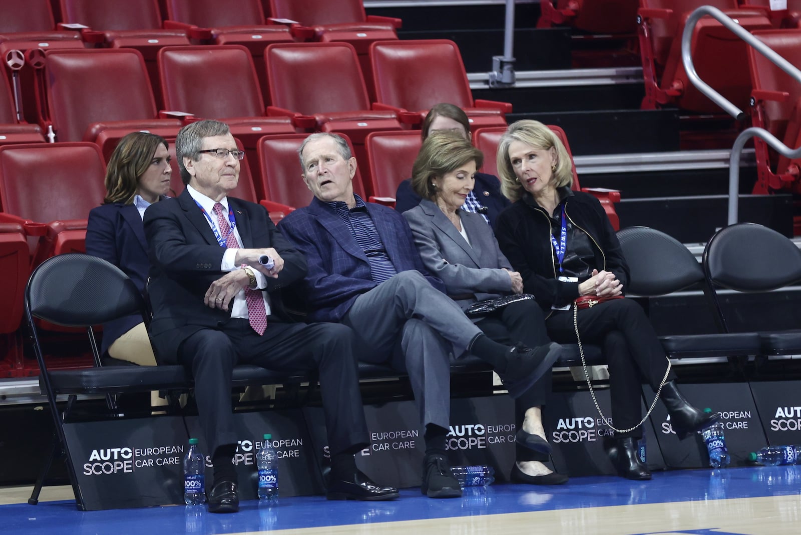 George W. Bush, second from left, and Laura Bush, second from right, sit courtside at Moody Coliseum on Wednesday, Nov. 29, 2023, before a game between Dayton and SMU in Dallas, Texas. David Jablonski/Staff