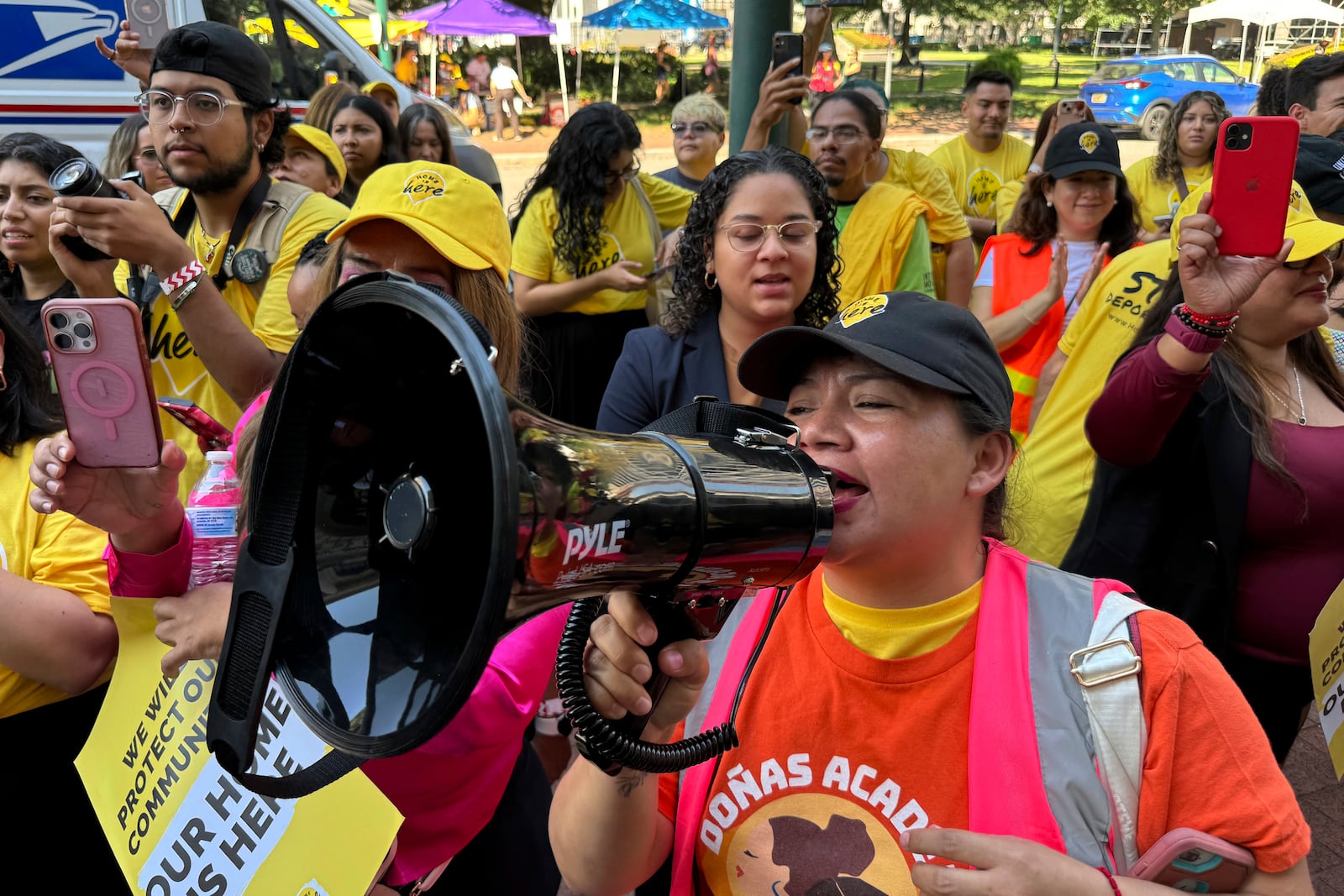 DACA supporter Claudia Valdivia wields a megaphone at a rally outside federal appeals court in New Orleans on Thursday, Oct. 10 ,2024. (AP Photo/Jack Brook)