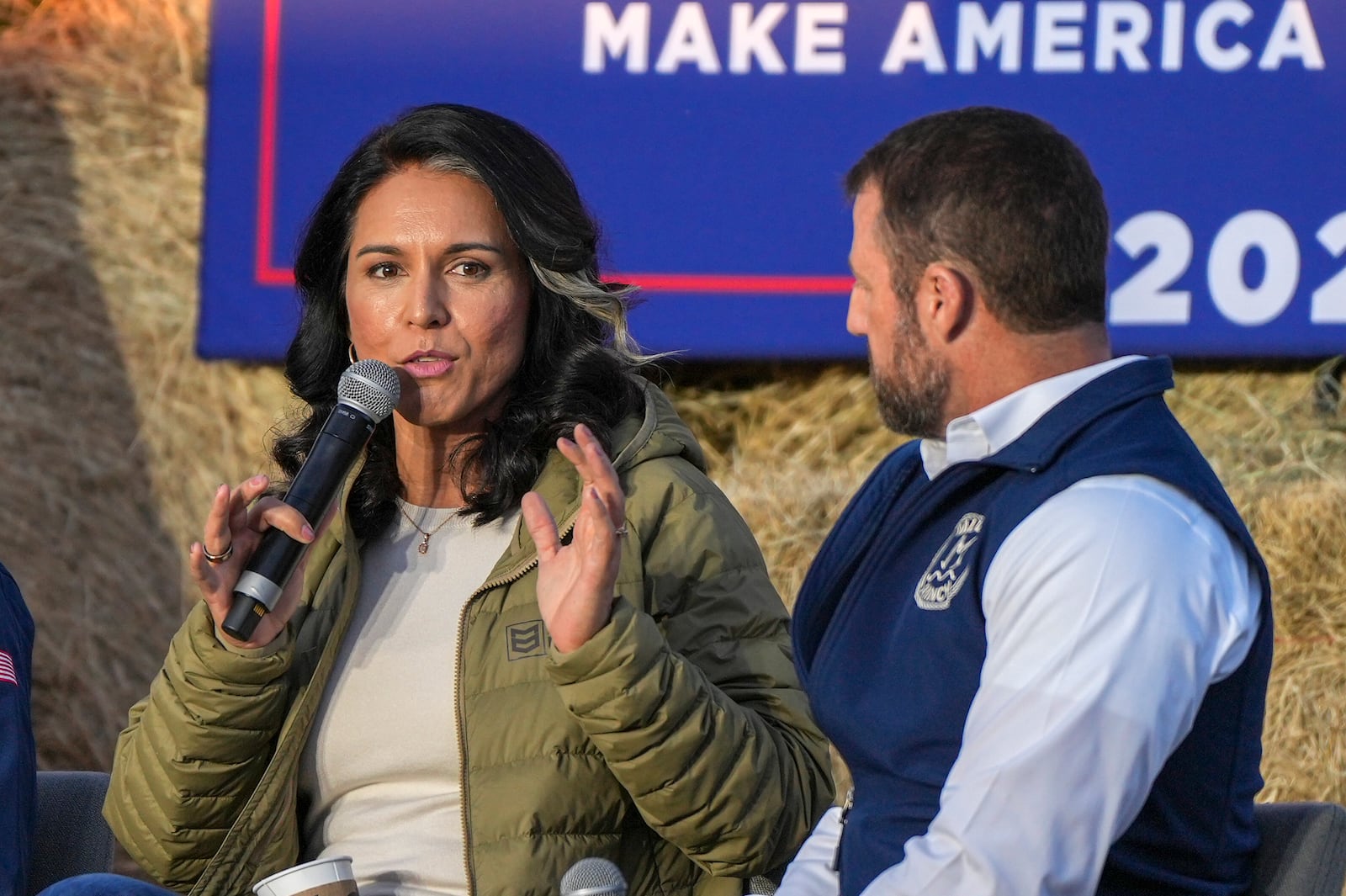 Former Democratic Rep. Tulsi Gabbard speaks during a campaign event in support of Republican presidential candidate former President Donald Trump, Friday, Oct. 18, 2024, in Red Springs, N.C. as Sen. Markwayne Mullin, R-Okla., listens (AP Photo/David Yeazell)