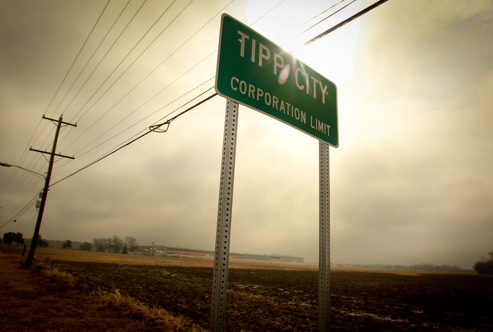 The existing Meijer distribution center in the distance behind the Tipp City limits sign. JIM WITMER/STAFF