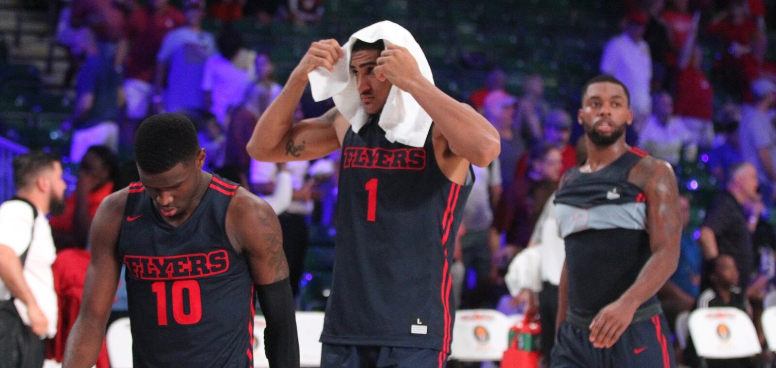 Dayton players (left to right) Jalen Crutcher, Obi Toppin and Trey Landers leave the court after a loss to Oklahoma on Friday, Nov. 23, 2018, in the third-place game of the Battle 4 Atlantis at Imperial Gym on Paradise Island, Bahamas. David Jablonski/Staff