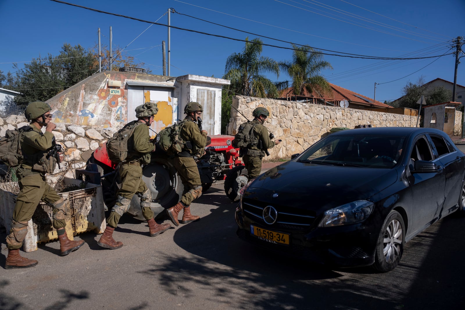 Israeli soldiers patrol the perimeter of the agricultural settlement of Avivim, next to the Lebanese border, in upper Galilee, Israel, Monday Dec. 2, 2024. (AP Photo/Ohad Zwigenberg)