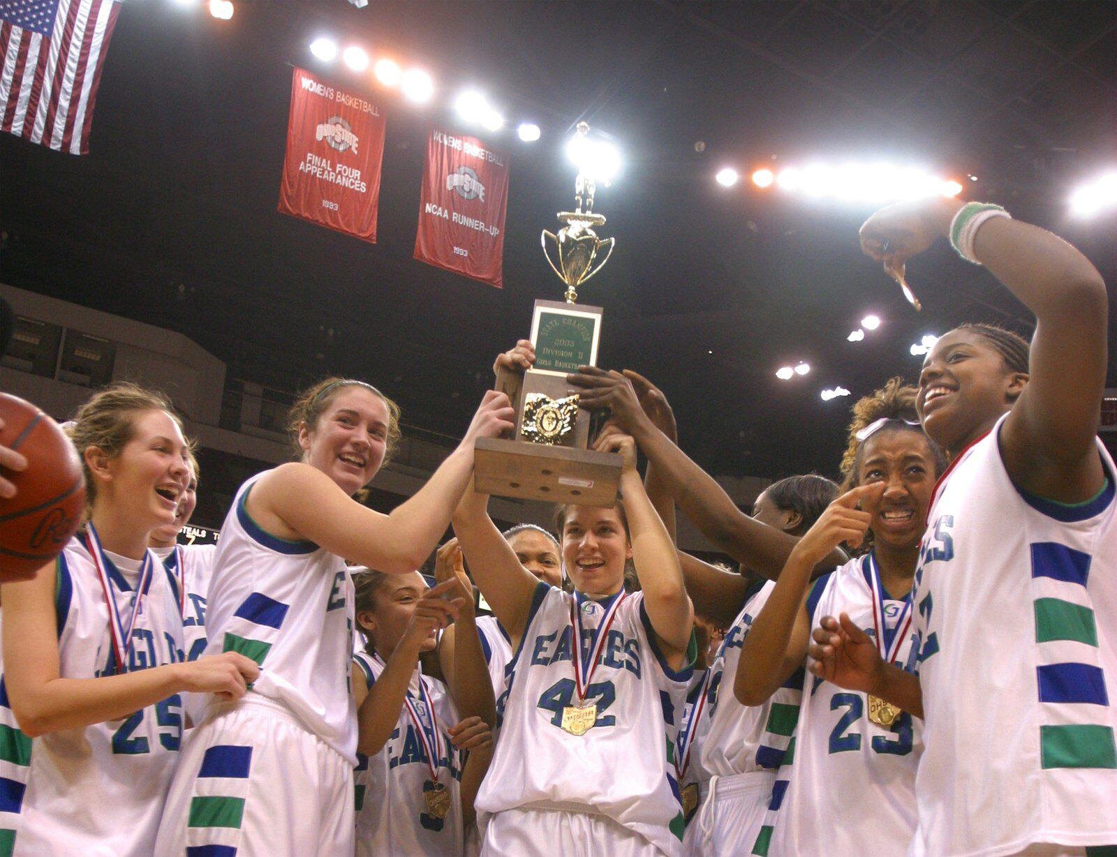 The Chaminade-Julienne girls basketball team celebrates its Division II state championship victory against Villa Angela-St. Joseph on March 15, 2003. TY GREENLEES / STAFF