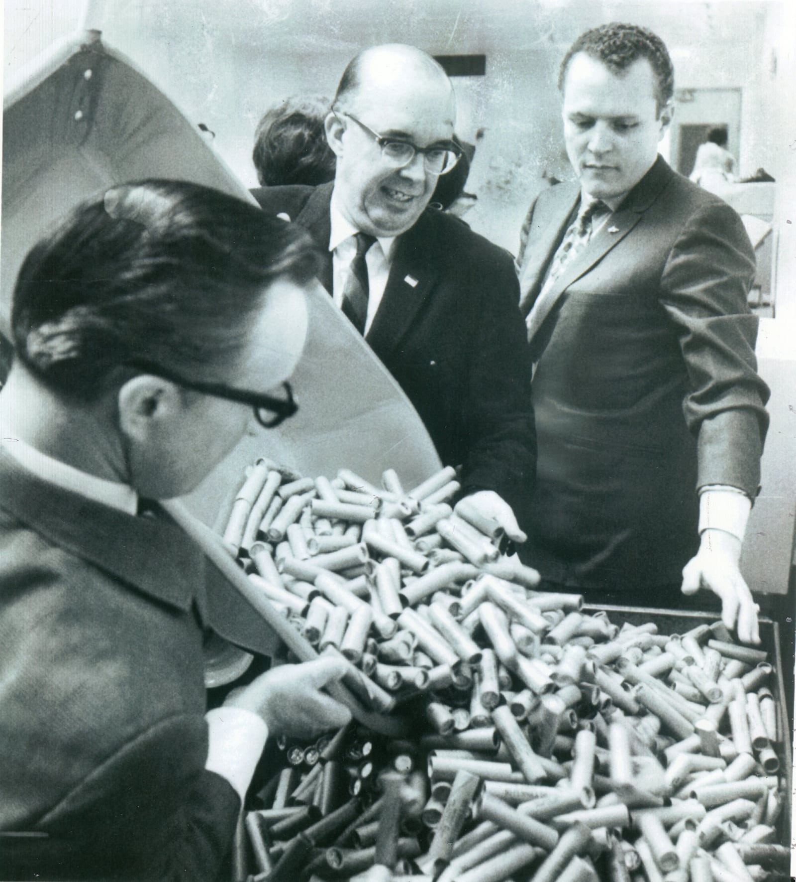 Larry Flynt (right) used 12,000 rolls of pennies to pay Dayton's Third National Bank the $6,000 he still owed on his Cadillac limousine in 1969. Flynt and a "gaggle of go-go girls" from his club hauled the pennies in a wheel barrow up Main Street. DAYTON DAILY NEWS / WRIGHT STATE UNIVERSITY SPECIAL COLLECTIONS AND ARCHIVES