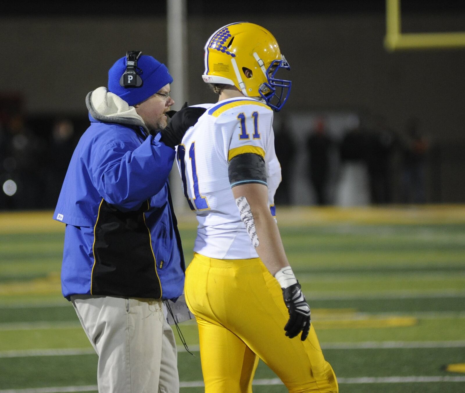 Marion Local coach Tim Goodwin and senior TE/LB Sam Huelsman. Marion Local defeated Coldwater 40-19 in a Week 13 high school football playoff game at Sidney on Friday, Nov. 16, 2018. MARC PENDLETON / STAFF