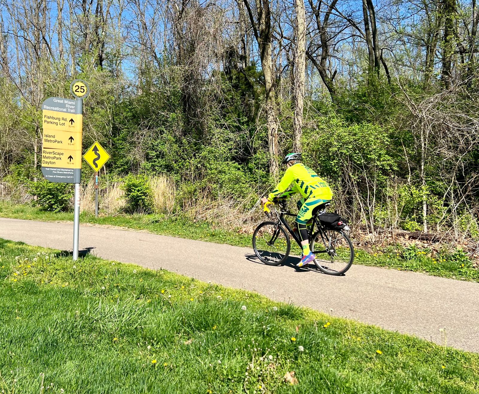 A bicyclist uses the multi-use trail in Taylorsville MetroPark on a sunny April 18, 2024. AIMEE HANCOCK / STAFF