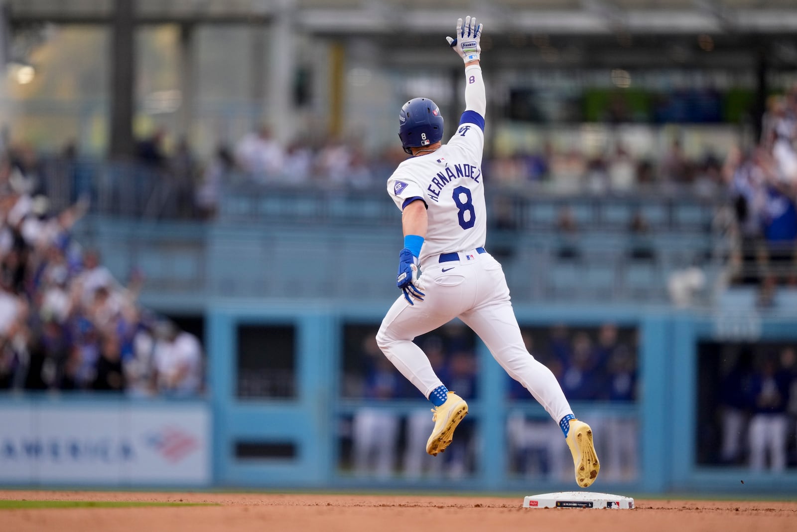 Los Angeles Dodgers' Kiké Hernández celebrates as he rounds second base following his solo home run during the second inning in Game 5 of a baseball NL Division Series against the San Diego Padres, Friday, Oct. 11, 2024, in Los Angeles. (AP Photo/Mark J. Terrill)