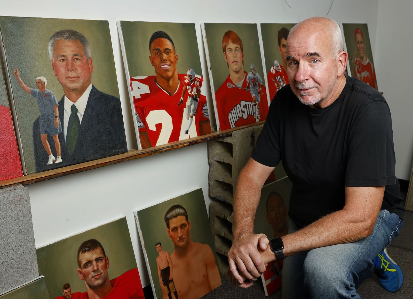 Former Ohio State University football player, Greg Storer, creates paintings for inductees into The Ohio University Athletics Hall of Fame in his art studio and teaching facility in Mason. The paintings are gifted to the inductees by the University at the induction ceremony. NICK GRAHAM/STAFF