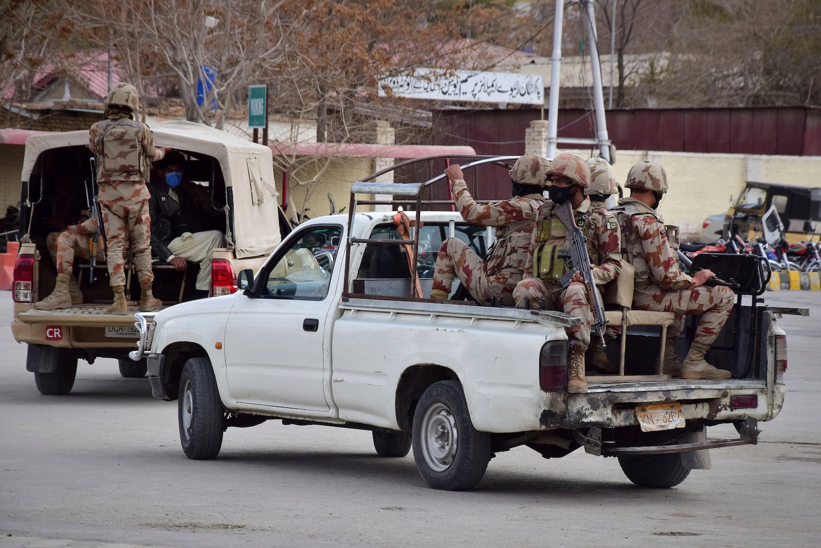 Pakistani soldiers arrive at the railway station to assist victims and survivors rescued by security forces from a train attacked by insurgents in Quetta, Pakistan, Wednesday, March 12, 2025. (AP Photo/Arshad Butt)