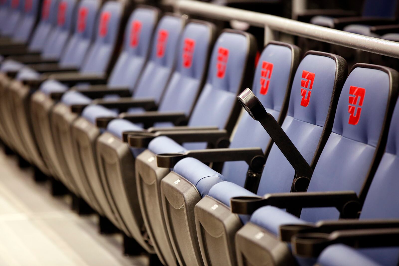 All seats in the 100 and 200 sections of UD Arena have been replaced as part of phase on renovations and include cup holders.  The center court sections include embroidered UD Flyers logo.  TY GREENLEES / STAFF