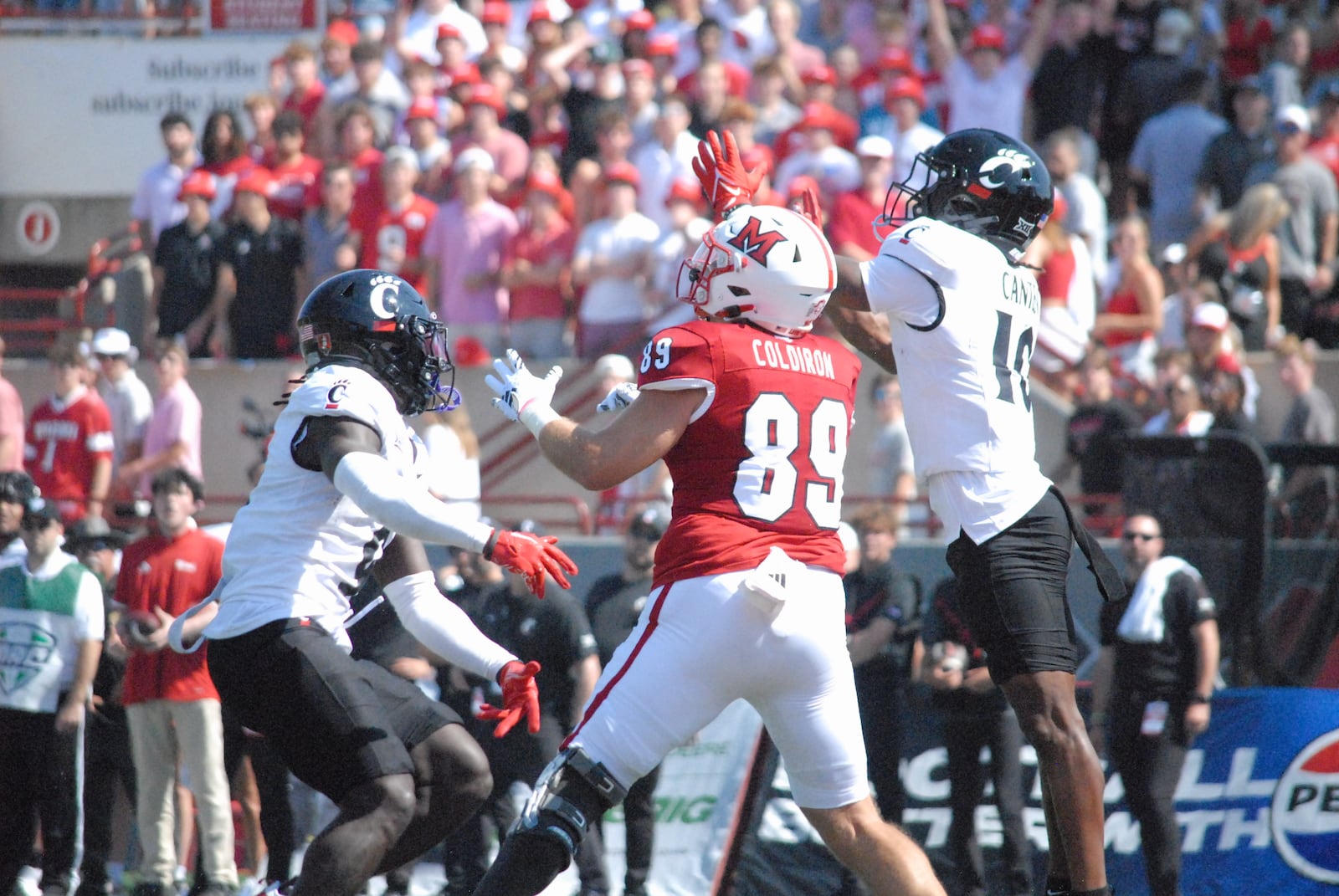 Miami's Jack Coldiron goes up for a pass against Cincinnati last week. Chris Vogt/CONTRIBUTED