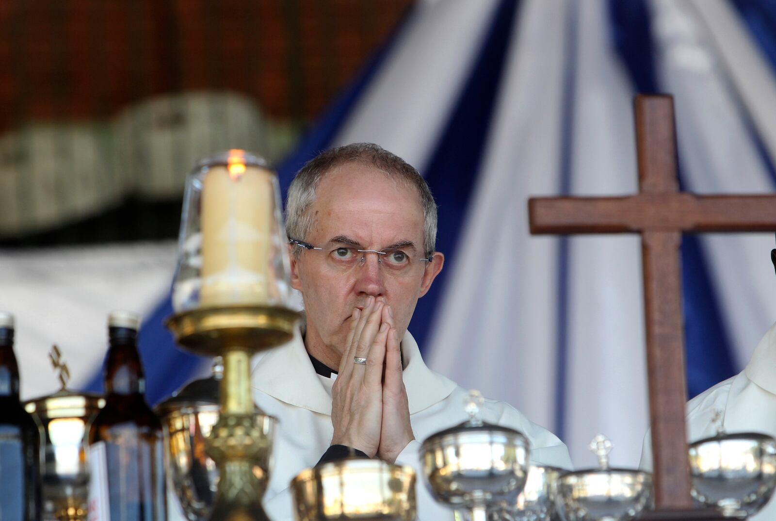 FILE - Britain's Archbishop of Canterbury, Justin Welby conducts a church service with Anglicans in Harare, Zimbabwe, Sunday, April, 17, 2016. (AP Photo/Tsvangirayi Mukwazhi, File)