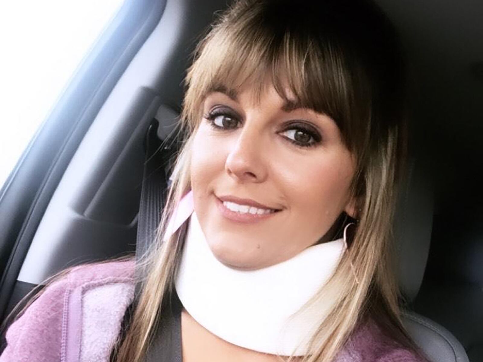 Wearing a neck brace, Frantz heads to neurotherapy, which she said helped teach her positivity during recovery.