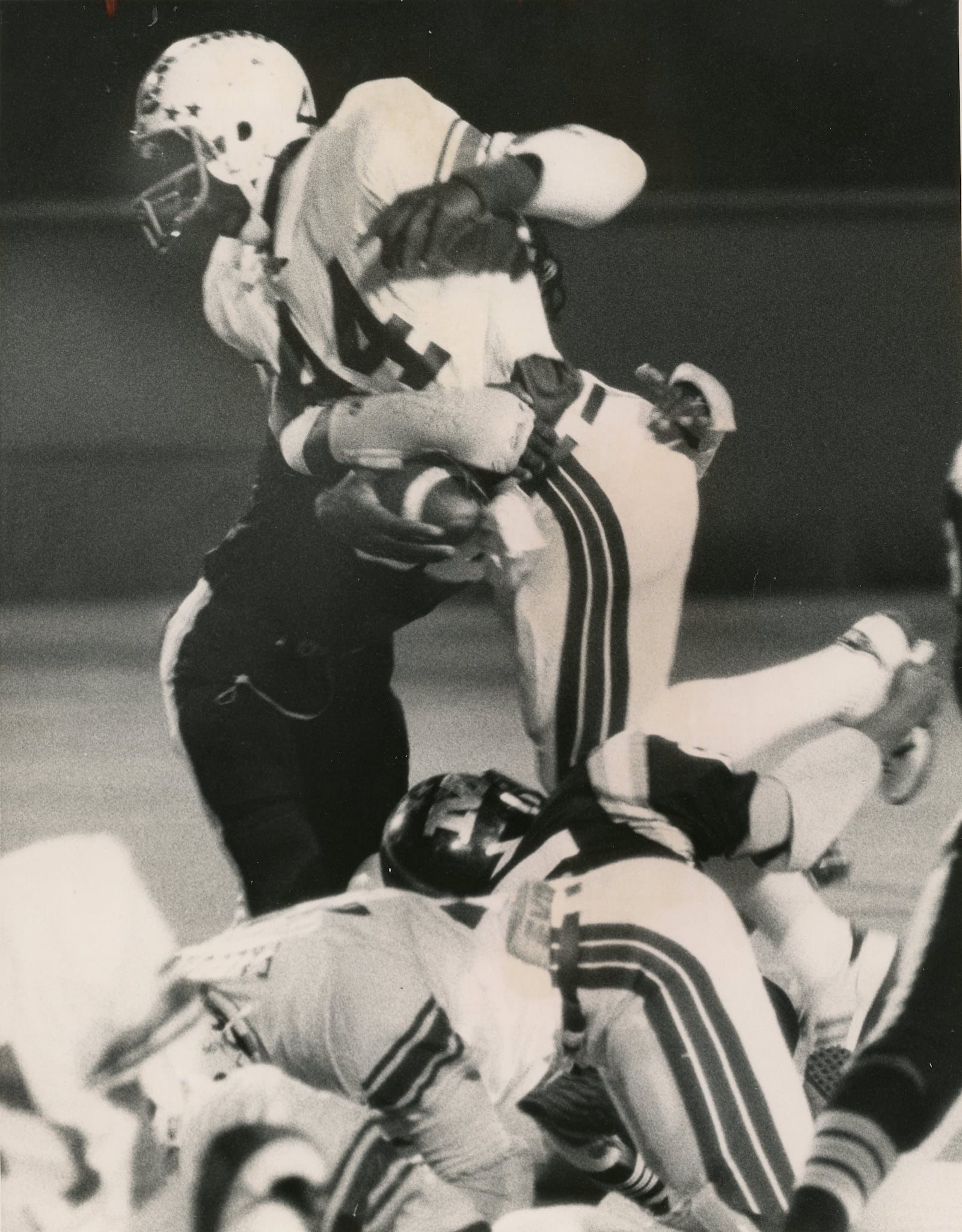 Roth High School running back Keith Byars (44) is stopped by a Meadowdale defender on Oct. 10. 1981 at Welcome Stadium. Byars went on to stardom at Ohio State and a 13-year NFL career. Photo courtesy of DDN Collection at Wright State University Special Collections & Archives