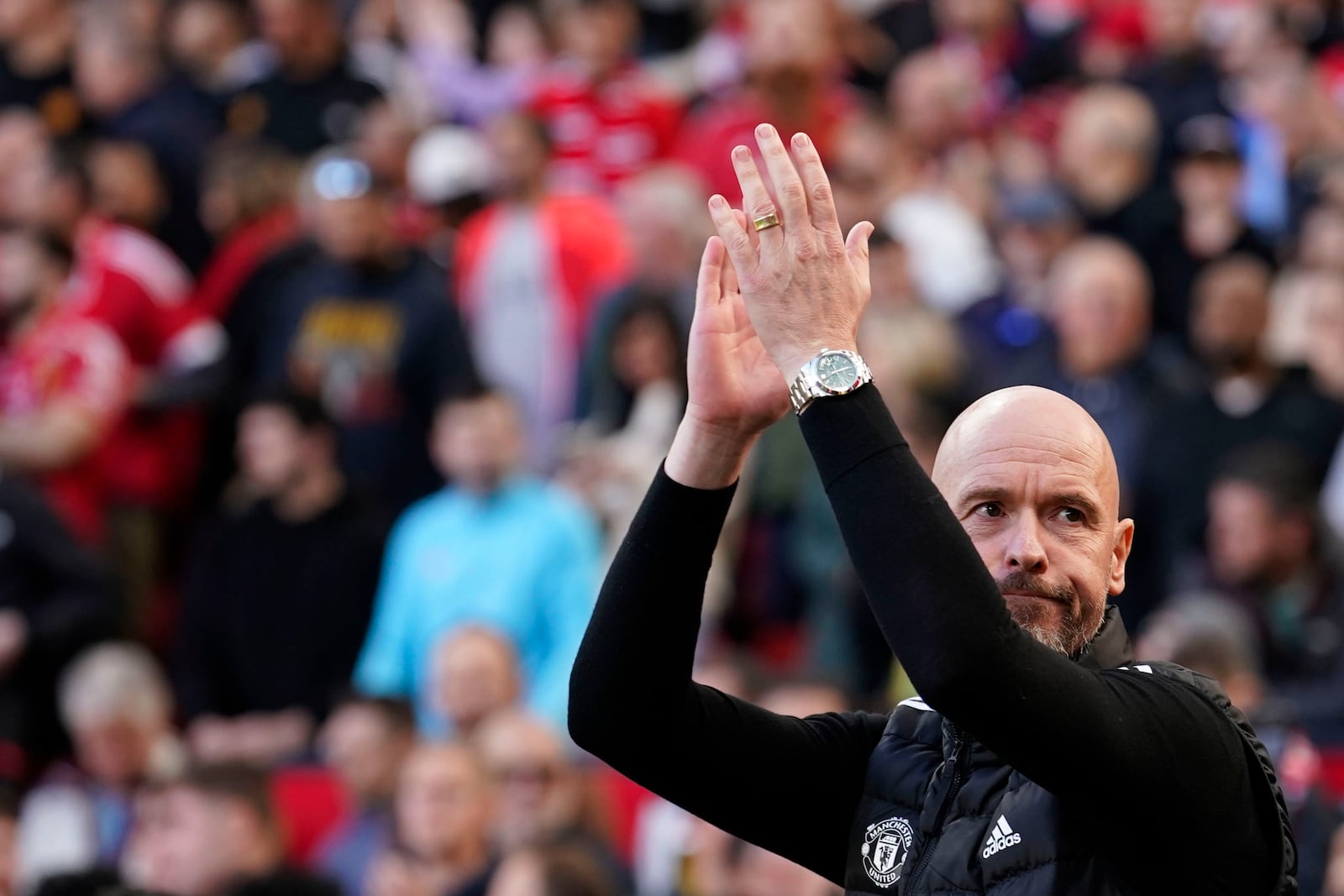 Manchester United's head coach Erik ten Hag applauds to supporters before the English Premier League soccer match between Manchester United and Brentford at Old Trafford stadium in Manchester, England, Saturday, Oct. 19, 2024. (AP Photo/Dave Thompson)