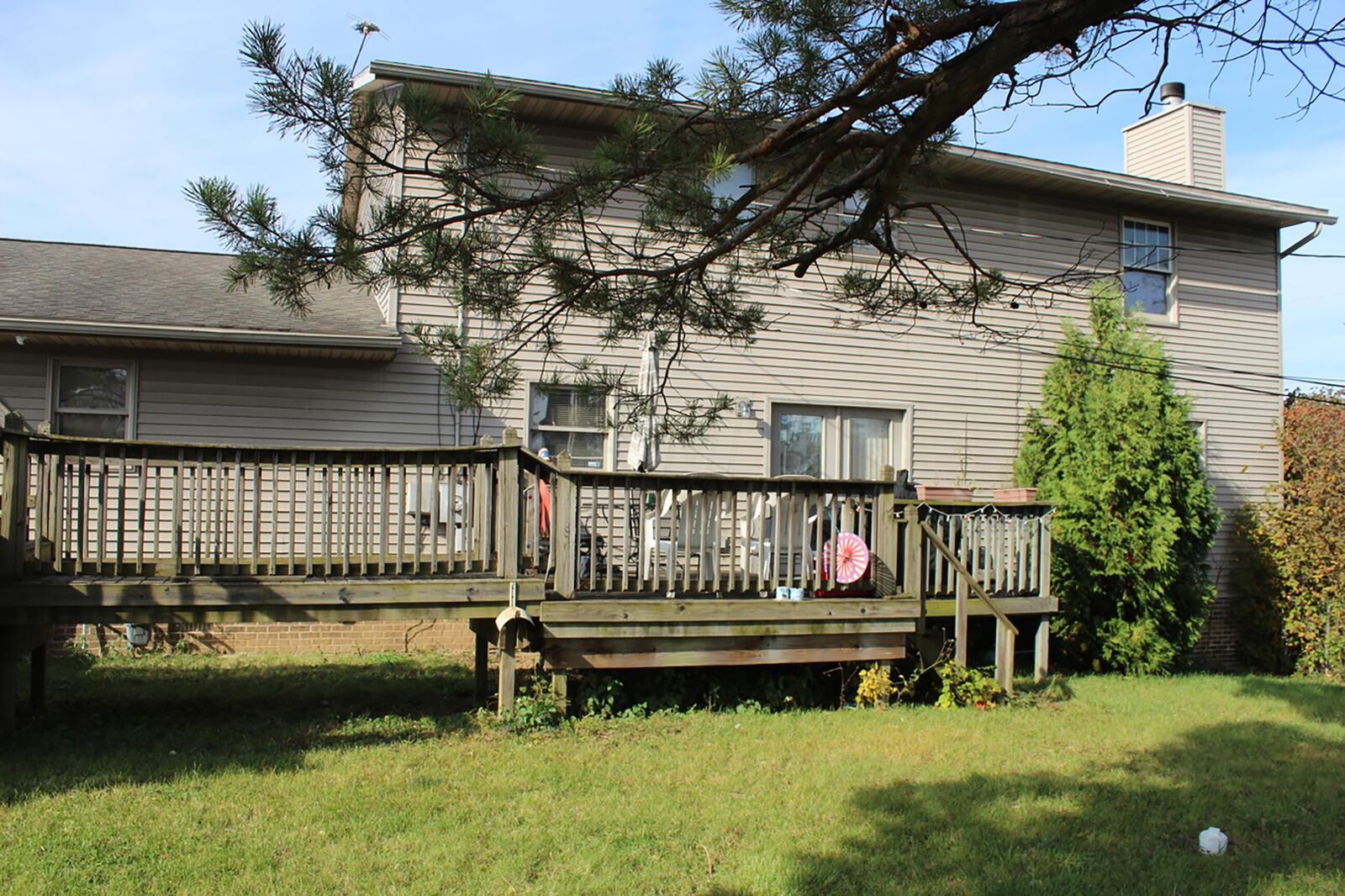 The rear of the home has a wood two-level deck and French doors access the breakfast area and family room. Contributed photo 