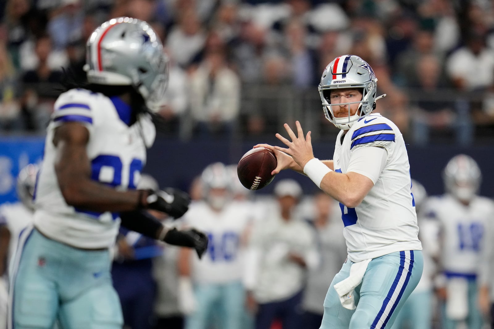 Dallas Cowboys quarterback Cooper Rush (10) prepares to throw a pass to CeeDee Lamb, left, in the first half of an NFL football game against the Philadelphia Eagles in Arlington, Texas, Sunday, Nov. 10, 2024. (AP Photo/Julio Cortez)