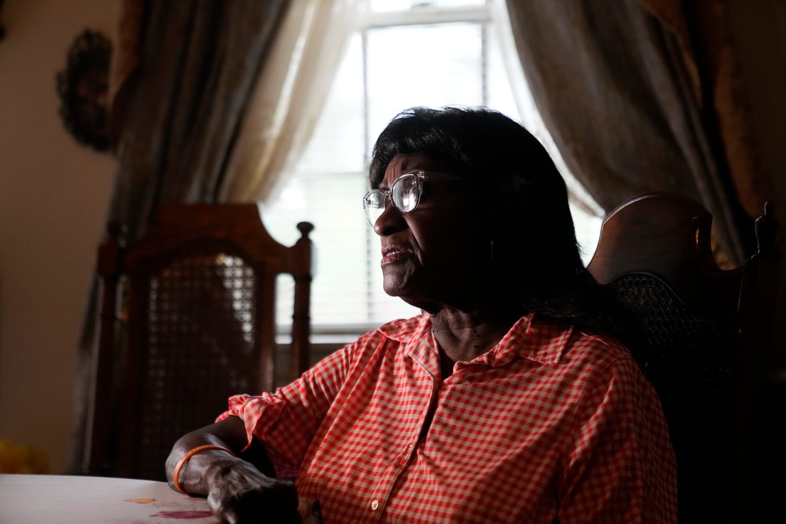 Rose Wilright, 80, speaks about the industrial expansion next to her home in St. Rose, La., Friday, Aug. 16, 2024. (AP Photo/Gerald Herbert)