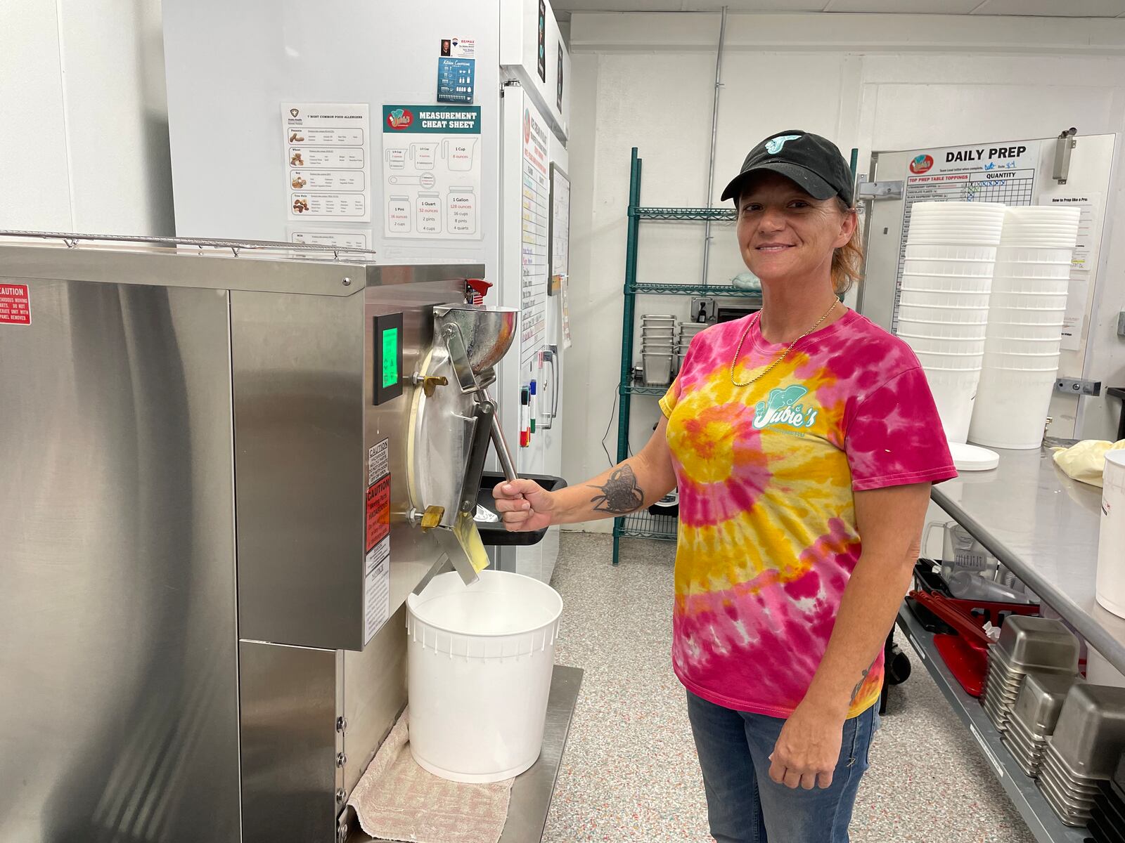 Susie Jagoditz, the kitchen manager at Jubie’s Creamery in Fairborn, makes a batch of Batman featuring banana ice cream swirled with tons of Oreos.