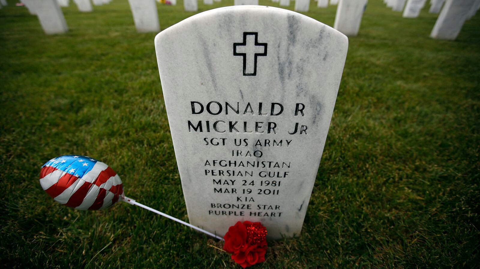 Gravesite of Army Sgt. Donald Mickler, Jr. who was killed in action. Mickler served in Iraq, Afghanistan and the Persian Gulf and is interred at the Dayton National Cemetery.  TY GREENLEES / STAFF