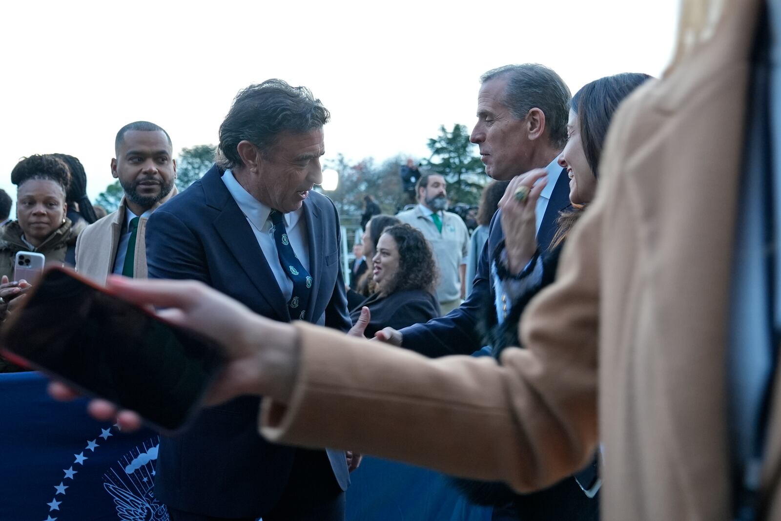 Hunter Biden, second from right, talks with Boston Celtics owner Wyc Grousbeck, left, following an welcoming the Boston Celtics to celebrate their victory in the 2024 National Basketball Association Championship, on the South Lawn of the White House in Washington, Thursday, Nov. 21, 2024. (AP Photo/Susan Walsh)