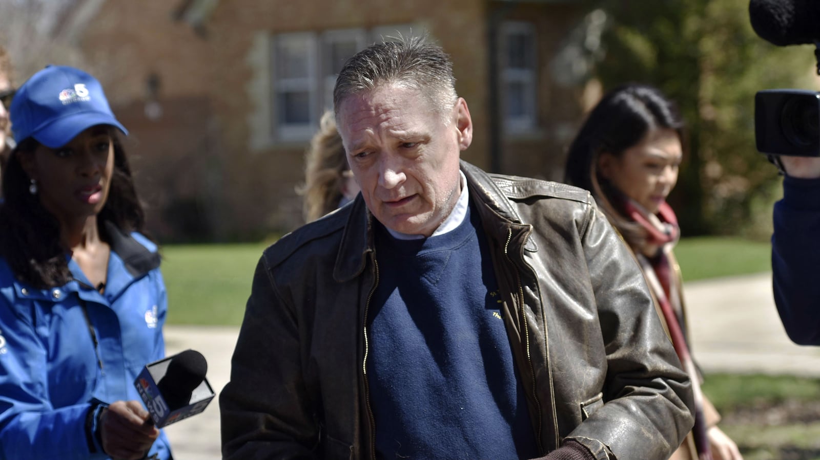 Andrew Freund Sr., the father of missing 5-year-old Andrew "A.J." Freund, walks near his home on Dole Avenue in Crystal Lake, Ill. on Friday, April 19, 2019, as members of the media try to speak with him. Crystal Lake police say K-9s have not found the scent of the boy, who was reported missing the previous morning by his parents, anywhere other than inside the house, which they say indicates Andrew didn't leave on foot. Searchers from a total of 15 agencies have spent the past five days looking for the boy.