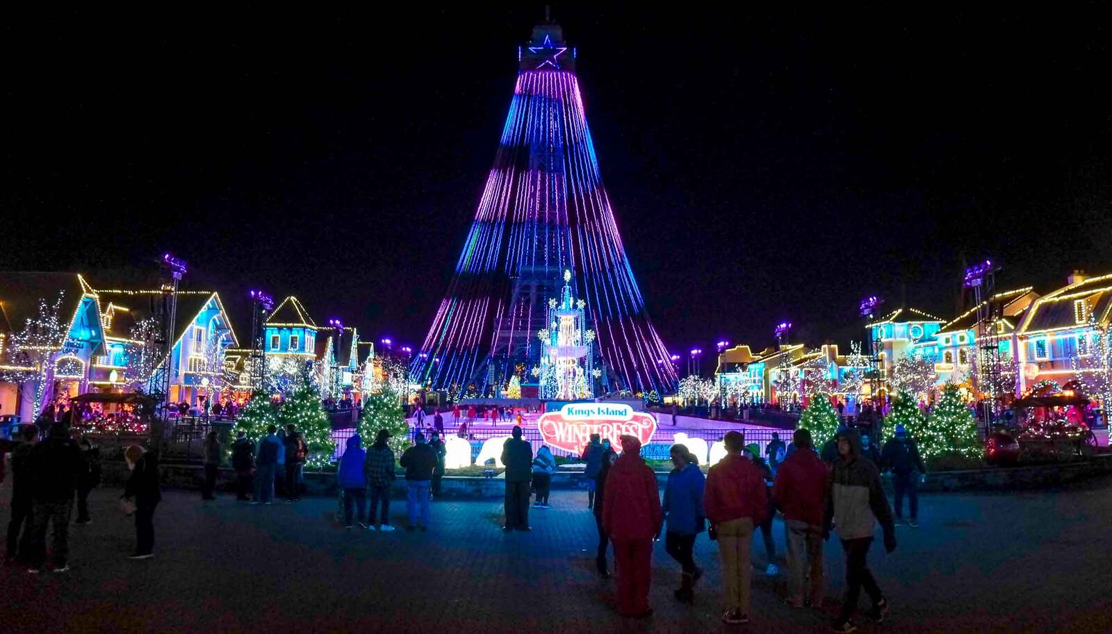 Scenes from opening night of Kings Island's Winterfest 2019. During Winterfest the park is transformed into an enchanted winter wonderland. The Eiffel Tower is look like a 314-foot tall Christmas tree  and there is ice skating on the Royal Fountain. Live shows, rides, delicious holiday treats, millions of lights and holiday characters are also spreading merriment throughout the park. GREG LYNCH / STAFF