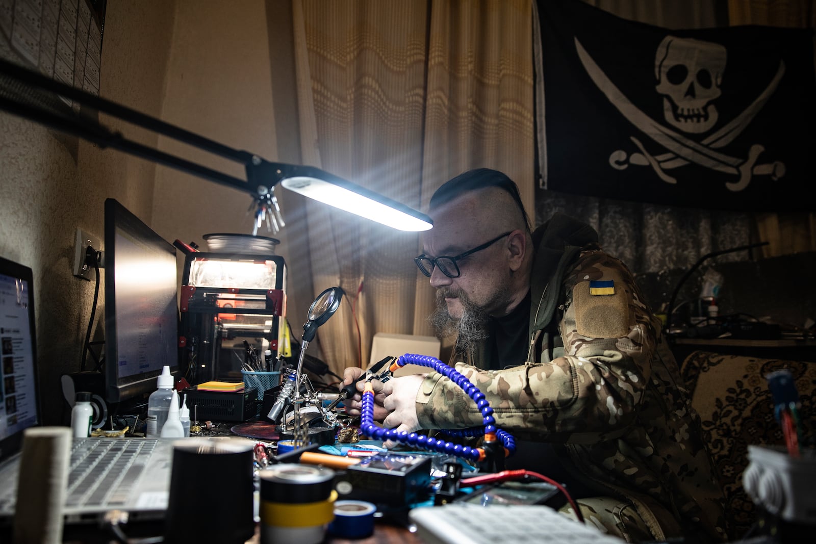 A Ukrainian soldier repairs a FPV drone in a drone repair workshop close to the front line near Siversk, Donetsk region, Ukraine, Thursday, Feb. 6, 2025. (AP Photo/Roman Chop)