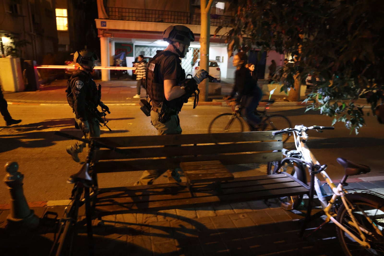 Israeli forces work at the scene of a stabbing attack in Tel Aviv, Israel, Tuesday, Jan. 21, 2025. (Tomer Appelbaum /Haaretz via AP)