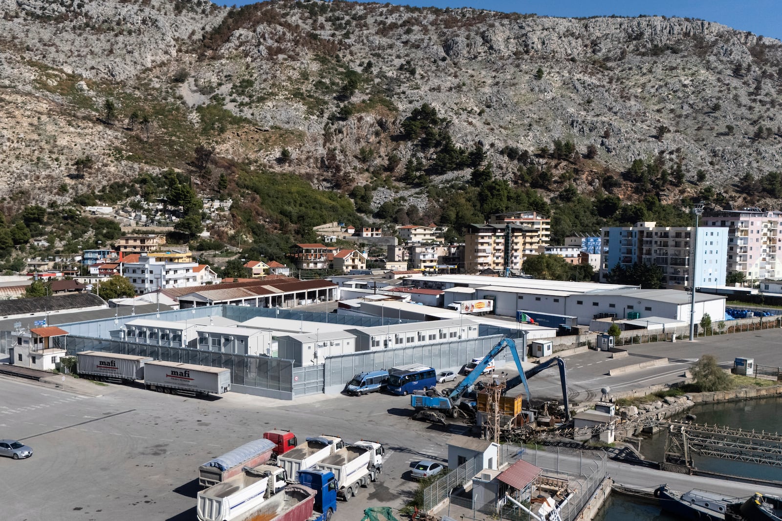 A general view of a migrant processing center at the port of Shengjin, northwestern Albania Wednesday, Oct. 16, 2024, as the first group of migrants who were intercepted in international waters arrived Wednesday. (AP Photo/Vlasov Sulaj)