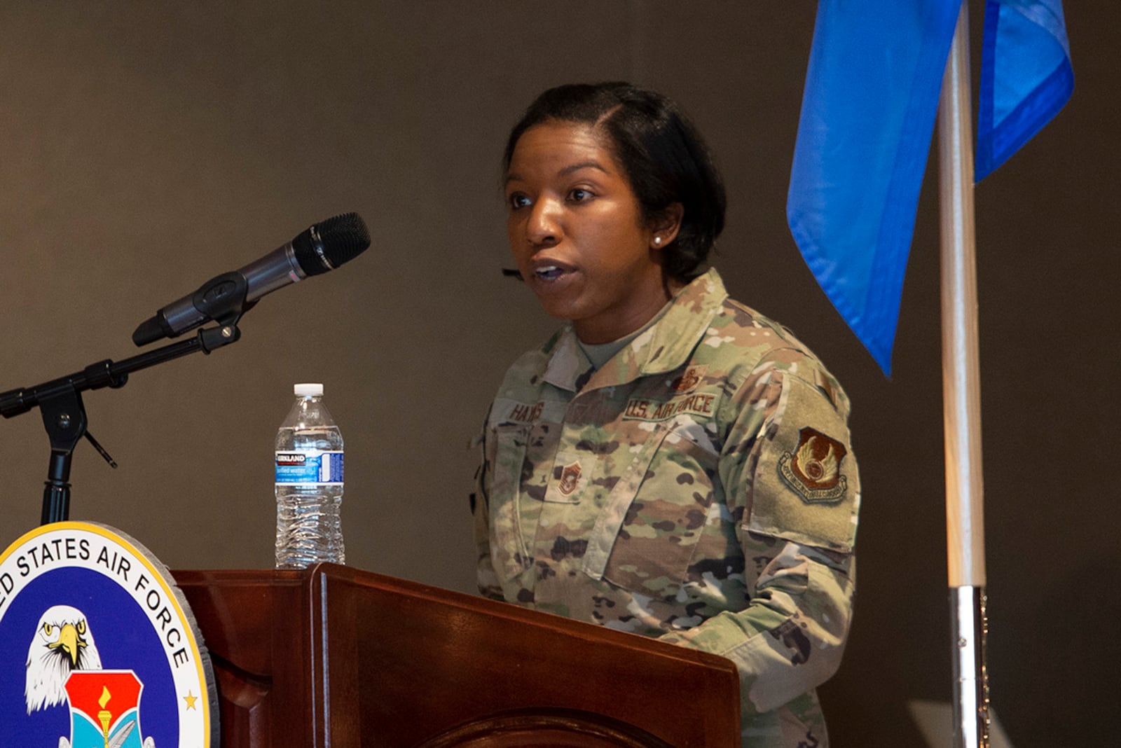 Chief Master Sgt. Sharma Haynes, 88th Comptroller Squadron, gives the keynote address to Airman Leadership School Class 22-A during its graduation ceremony Dec. 2 at Wright-Patterson Air Force Base. Haynes was the class mentor. U.S. AIR FORCE PHOTO/JAIMA FOGG