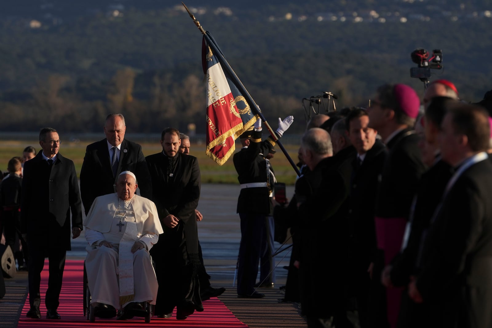 Pope Francis arrives at Ajaccio International Airport on the occasion of his one-day visit in the French island of Corsica, Sunday, Dec. 15, 2024. (AP Photo/Alessandra Tarantino)