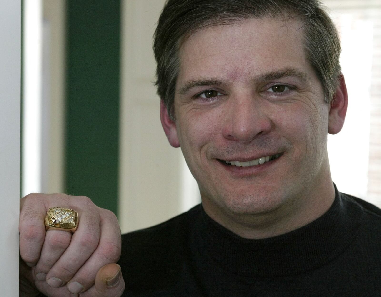 Jim Lachey poses with his super bowl ring in his home Friday Jan. 28, 2005 in Marble Cliff, Ohio. (AP Photo/Jay LaPrete)