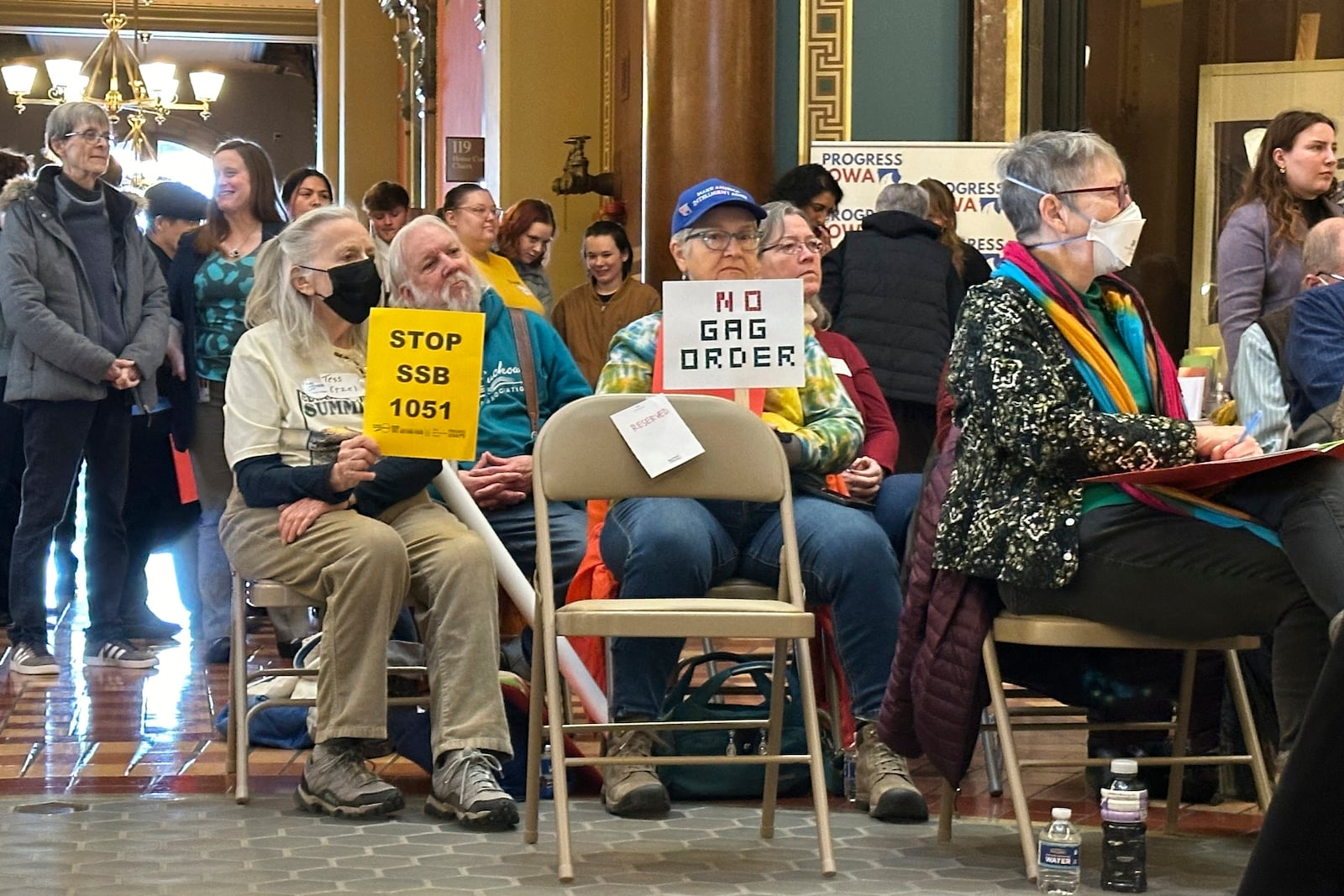 Protesters congregate at the Iowa state capitol building in Des Moines on Monday, Feb. 10, 2025, to rally against a bill that would protect pesticide companies from lawsuits that claim its popular weedkiller causes cancer. (AP Photo/Hannah Fingerhut)