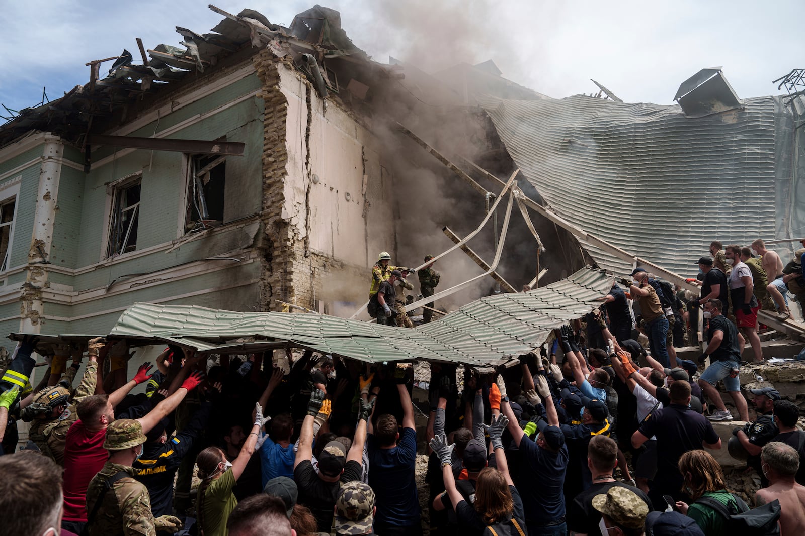 FILE - Emergency services work at the site of Okhmatdyt children's hospital hit by Russian missiles, in Kyiv, Ukraine, Monday, July 8, 2024. (AP Photo/Evgeniy Maloletka, File)