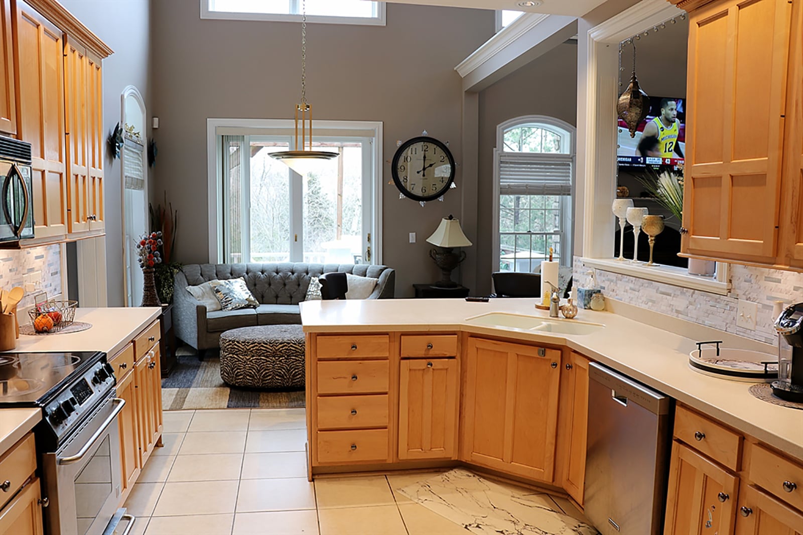 Maple cabinets with complementing Corian countertops fill the kitchen and surround stainless-steel appliances. A peninsula counter has a built-in sink and offers breakfast bar seating for up to four. CONTRIBUTED PHOTO BY KATHY TYLER