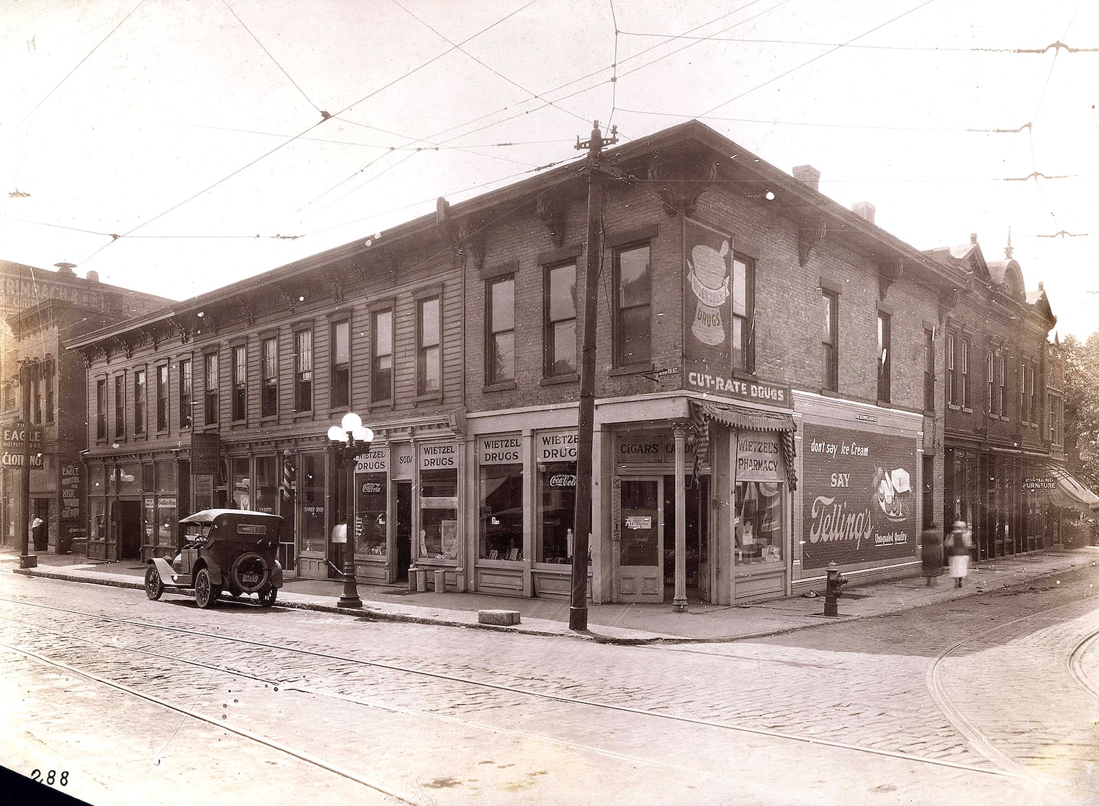 The southeast corner of Fifth and Brown Streets was built in 1850. Wietzel Drugs, a purveyor of cigars, candy and "cut-rate" drugs located its' business at the intersection. PHOTO COURTESY OF THE DAYTON METRO LIBRARY / LUTZENBERGER PICTURE COLLECTION http://content.daytonmetrolibrary.org/cdm/search/collection/lutzenberge/searchterm/Elias%20Heathman/order/nosort