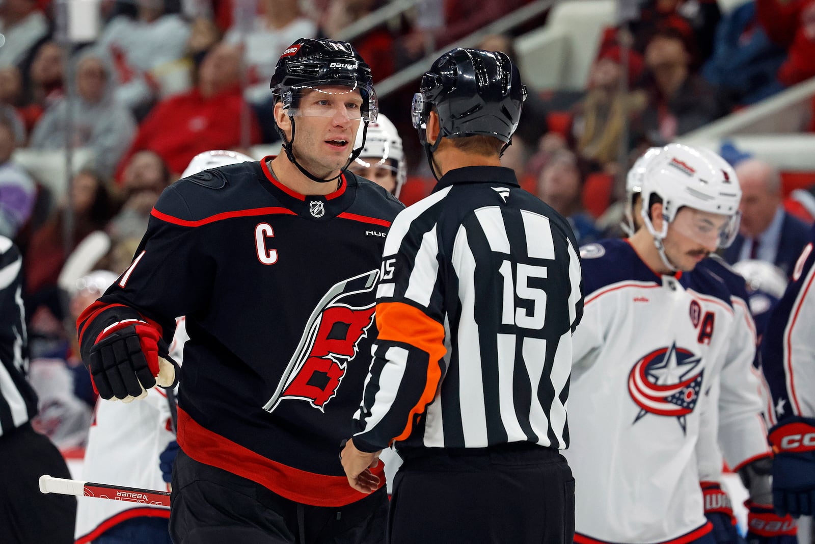 Carolina Hurricanes' Jordan Staal (11) protests a call with an official against the Columbus Blue Jackets during the first period of an NHL hockey game in Raleigh, N.C., Sunday, Dec. 15, 2024. (AP Photo/Karl B DeBlaker)