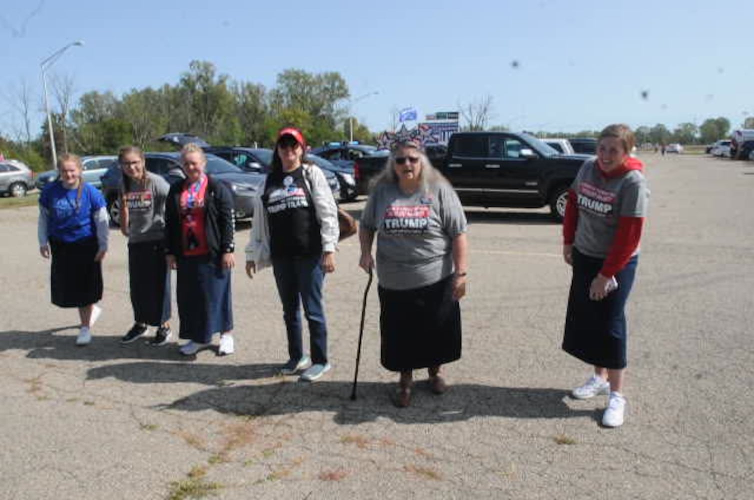 Trump supporters cheer out Dayton International Airport Monday.