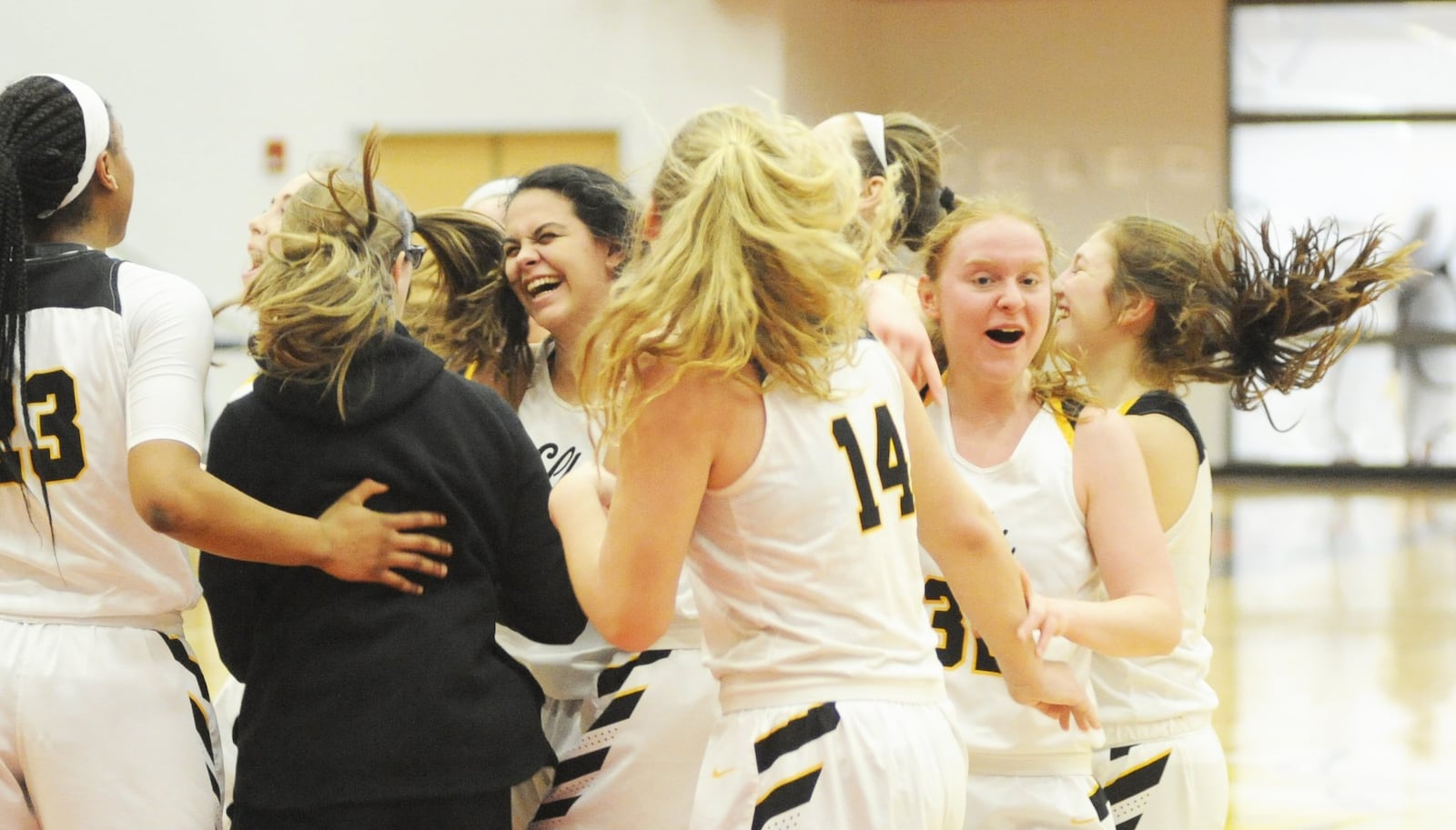 Centerville players celebrate. Centerville defeated Lakota West 67-55 in a girls high school basketball D-I district final at Princeton on Saturday, March 2, 2019. MARC PENDLETON / STAFF