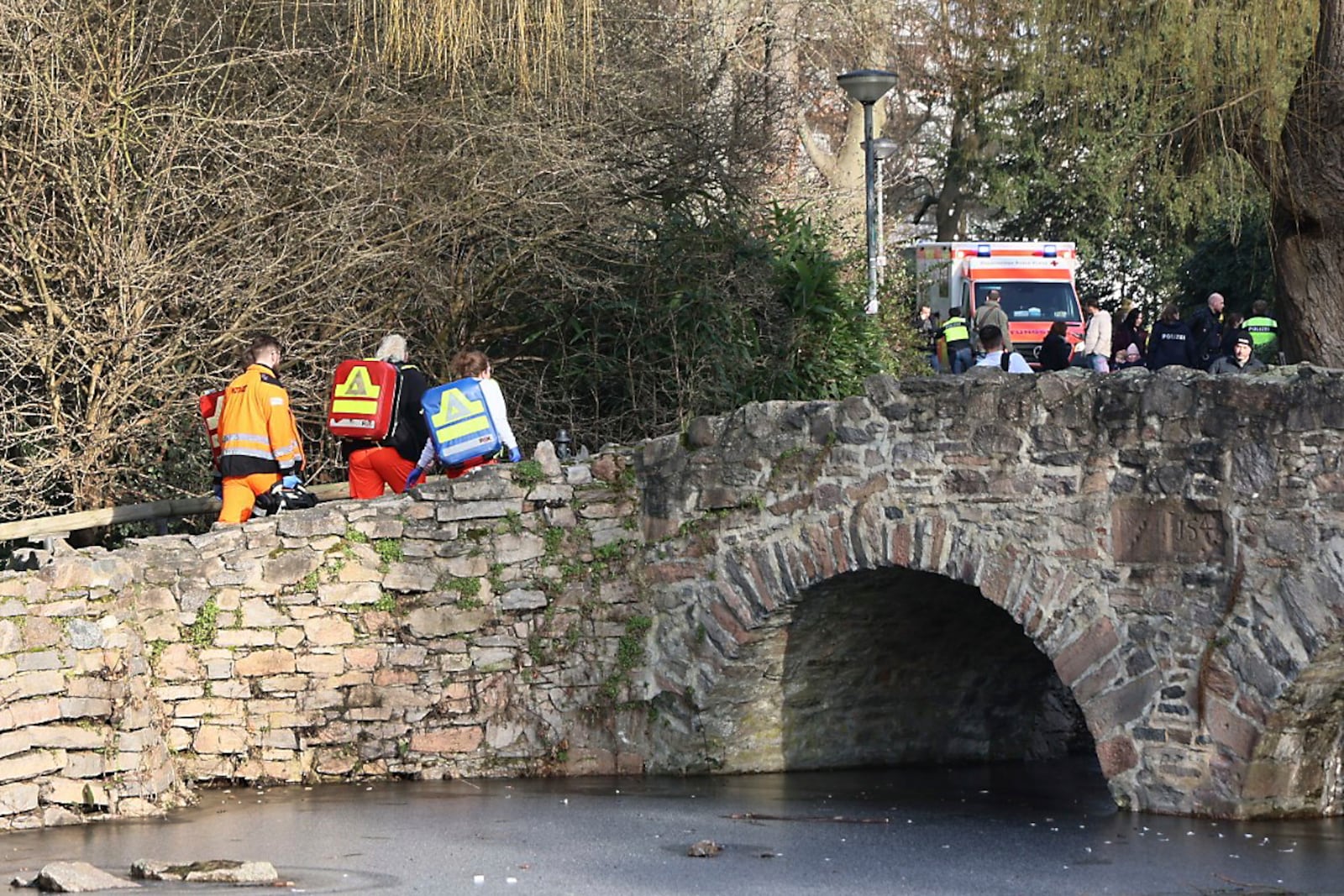 Rescue and security worker are seen near a crime scene in Aschaffenburg, Germany, Wednesday, Jan 22, 2025, where two people were killed in a knife attack. (Ralf Hettler/dpa via AP)