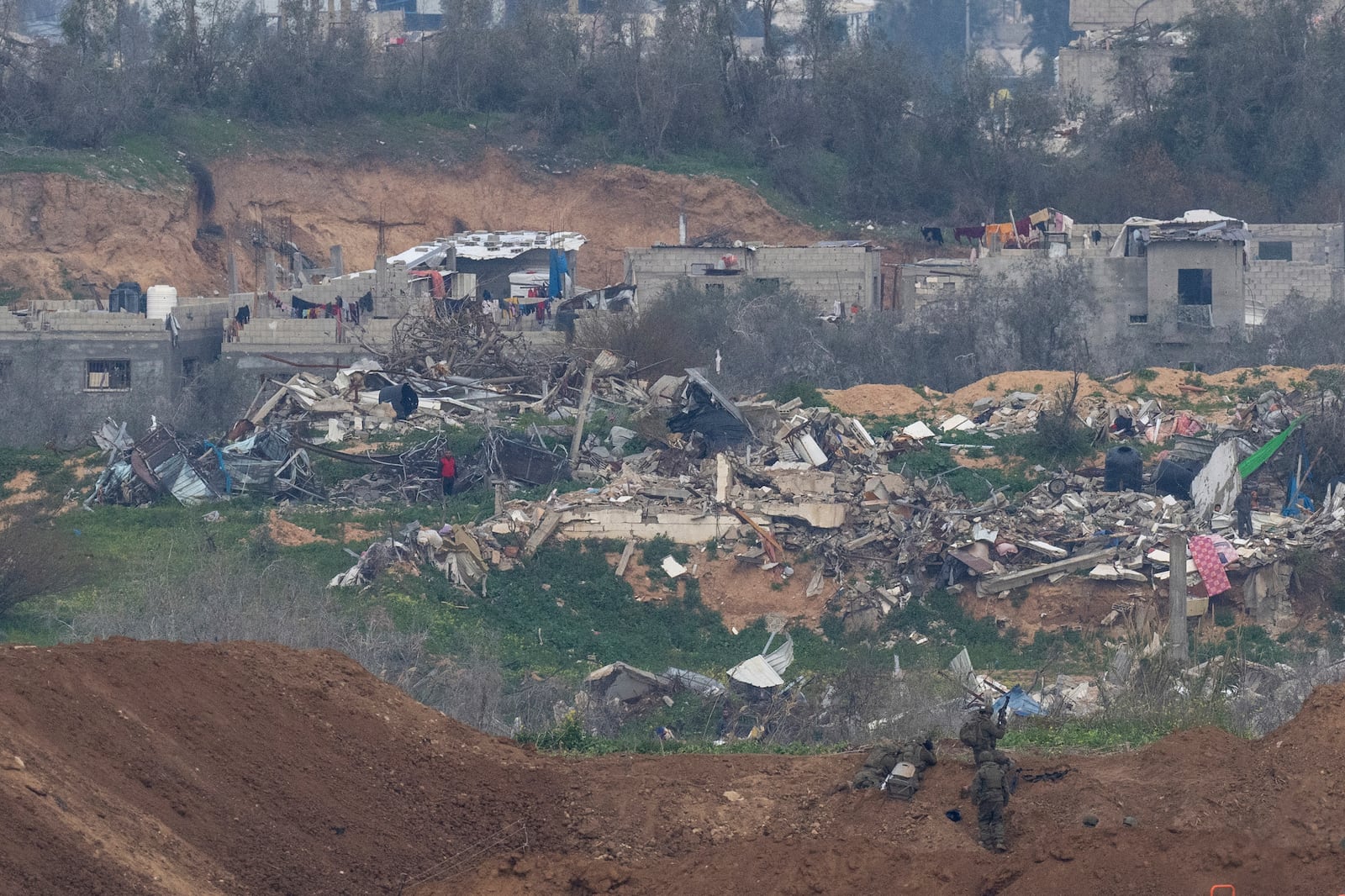 Israeli soldiers take positions near destroyed buildings inside the northern Gaza Strip as seen from southern Israel, Sunday, Feb. 9, 2025. (Photo/Ohad Zwigenberg)