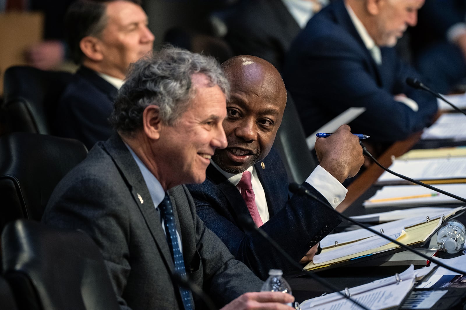 
                        FILE — Sen. Tim Scott (R-S.C.), right, chats with Sen. Sherrod Brown (D-Ohio), the committee chairman, during a hearing before the Senate Banking Committee in Washington on March 6, 2023. Scott’s support floats in the single digits, and several other national Republicans are also eyeing a presidential run. (Haiyun Jiang/The New York Times)
                      