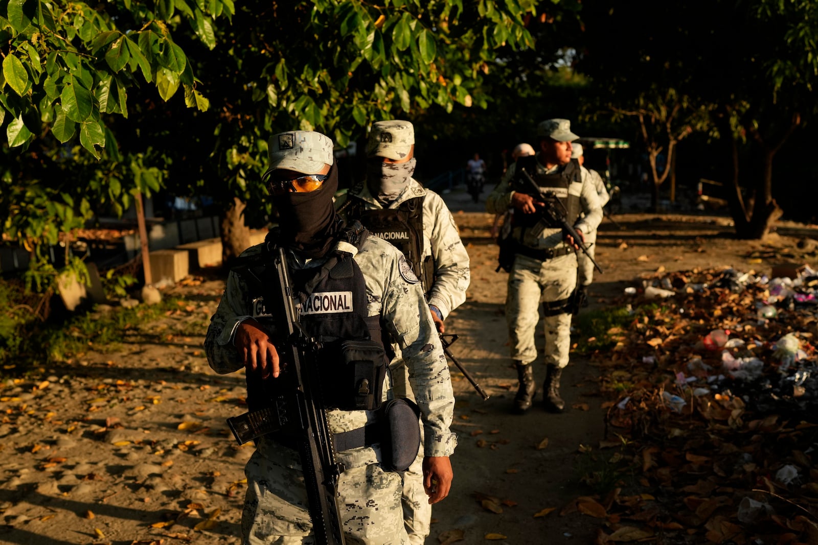 Police officers patrol next to Suchiate River in Ciudad Hidalgo, Mexico, on the border with Guatemala, Monday, Oct. 28, 2024. (AP Photo/Matias Delacroix)