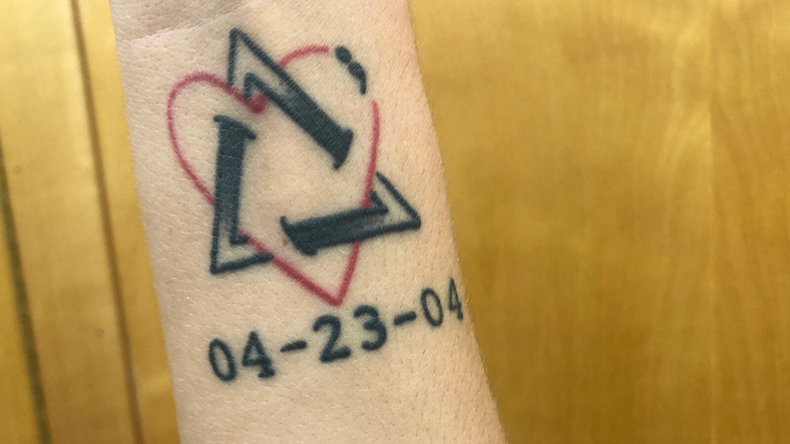 The tattoo of Butler High School senior volleyball player Olivia Follick symbolizes the date she was adopted by Chad and Amy Follick. Jeff Gilbert/CONTRIBUTED